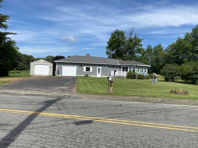 68 Stetson Rd, Newport, ME 04953 - single story home with driveway, a front lawn, an outbuilding, and a chimney