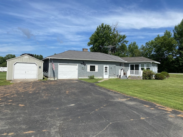 68 Stetson Rd, Newport, ME 04953 - ranch-style house featuring a front yard, asphalt driveway, a chimney, and a garage