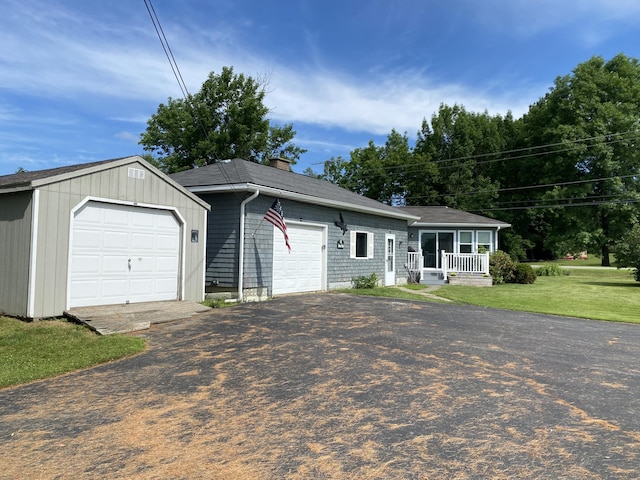 68 Stetson Rd, Newport, ME 04953 - single story home with a porch, a chimney, a front lawn, a shingled roof, and asphalt driveway