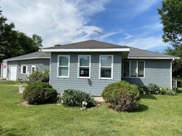 68 Stetson Rd, Newport, ME 04953 - back of house featuring a lawn and a garage