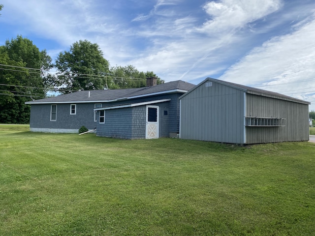 68 Stetson Rd, Newport, ME 04953 - back of property featuring a lawn, a chimney, and an outdoor structure