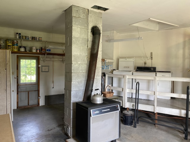 68 Stetson Rd, Newport, ME 04953 - basement featuring a wood stove and washer and dryer