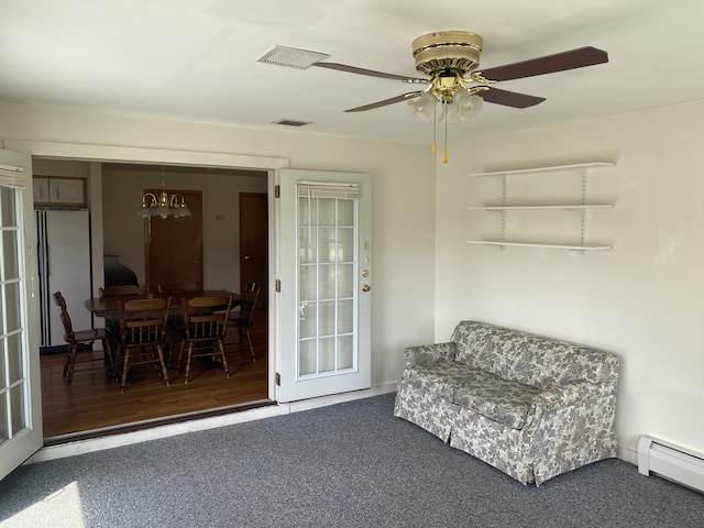 68 Stetson Rd, Newport, ME 04953 - sitting room with a baseboard heating unit, ceiling fan, carpet, and a chandelier