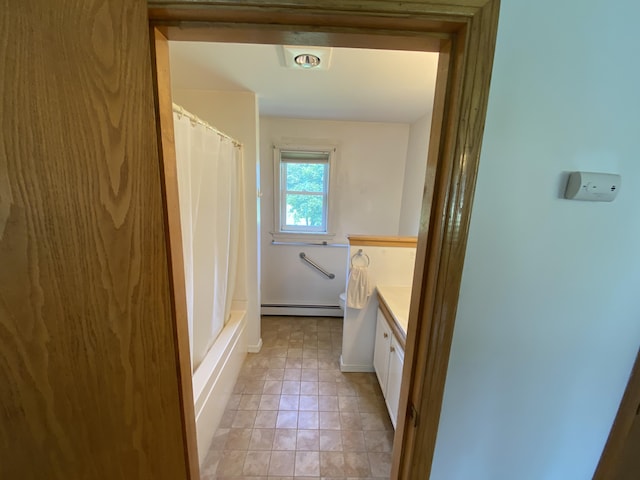 68 Stetson Rd, Newport, ME 04953 - bathroom with a baseboard radiator, vanity, tile patterned flooring, and shower / bathtub combination with curtain