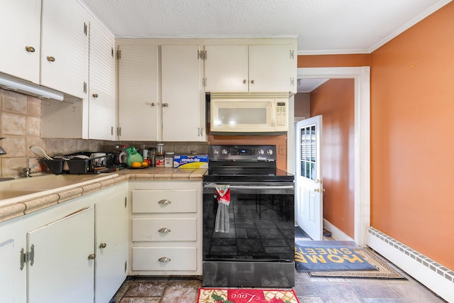 96 Holm Ave, Portland, ME 04102 - kitchen with electric range, white microwave, stone finish floors, tasteful backsplash, and baseboard heating