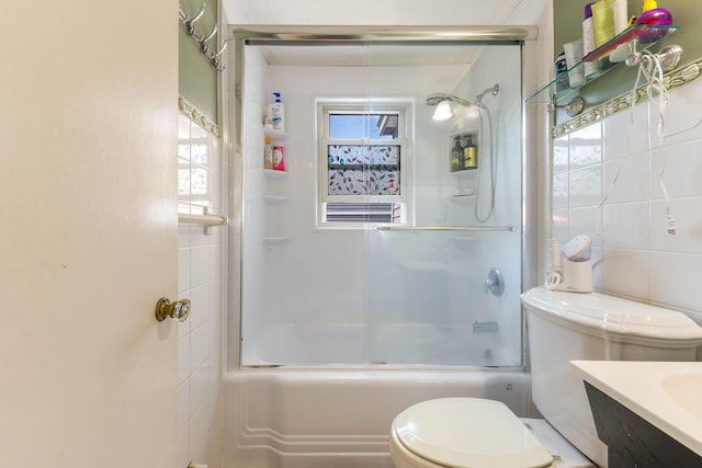 96 Holm Ave, Portland, ME 04102 - bathroom featuring tile walls, vanity, bath / shower combo with glass door, and healthy amount of natural light