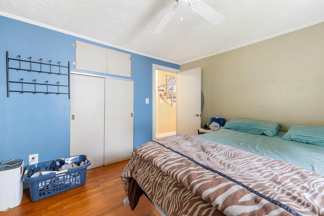 96 Holm Ave, Portland, ME 04102 - bedroom featuring wood finished floors, ornamental molding, a closet, and a ceiling fan