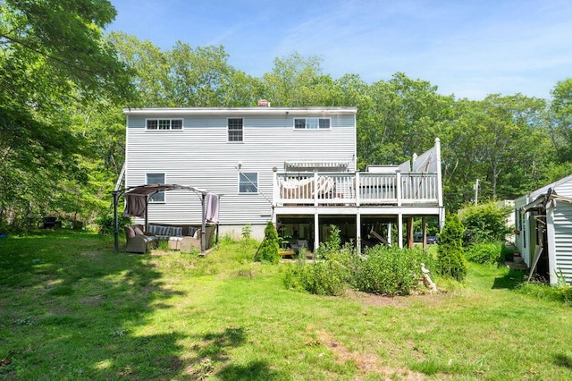 93 Bartlett Rd, Kittery, ME 03905 - rear view of house with a deck, a lawn, and a chimney