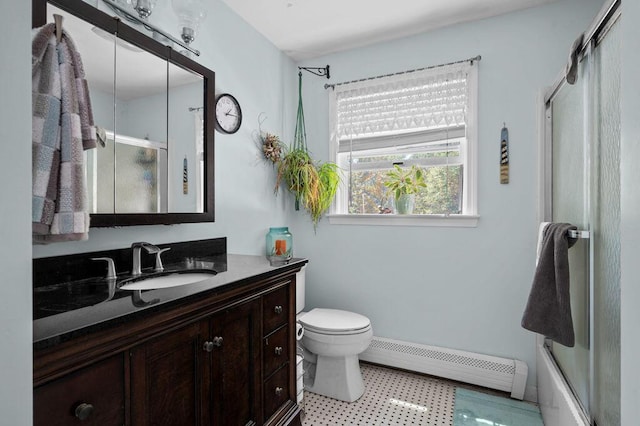 93 Bartlett Rd, Kittery, ME 03905 - bathroom featuring a baseboard heating unit, vanity, and bath / shower combo with glass door