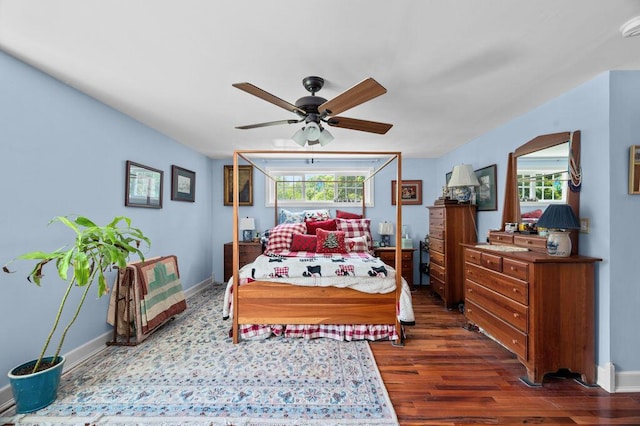 93 Bartlett Rd, Kittery, ME 03905 - bedroom with multiple windows, dark wood finished floors, and a ceiling fan