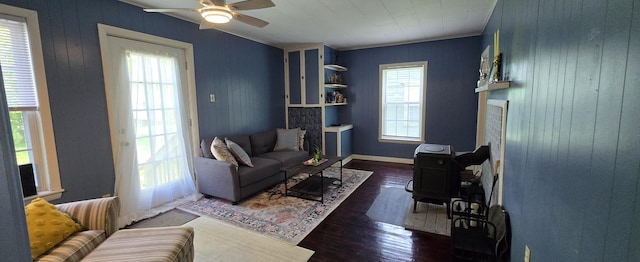 555 Depot St, Wilton, ME 04294 - living area featuring wood finished floors, ceiling fan, and wood walls