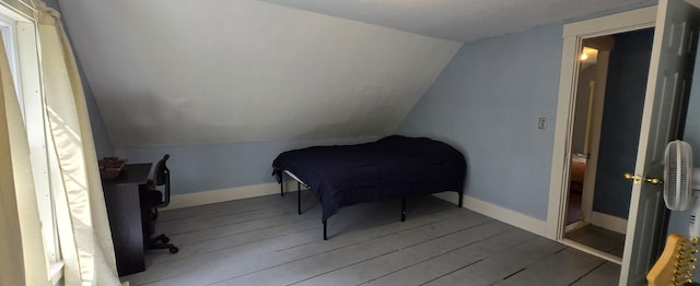 555 Depot St, Wilton, ME 04294 - bedroom featuring lofted ceiling and wood finished floors