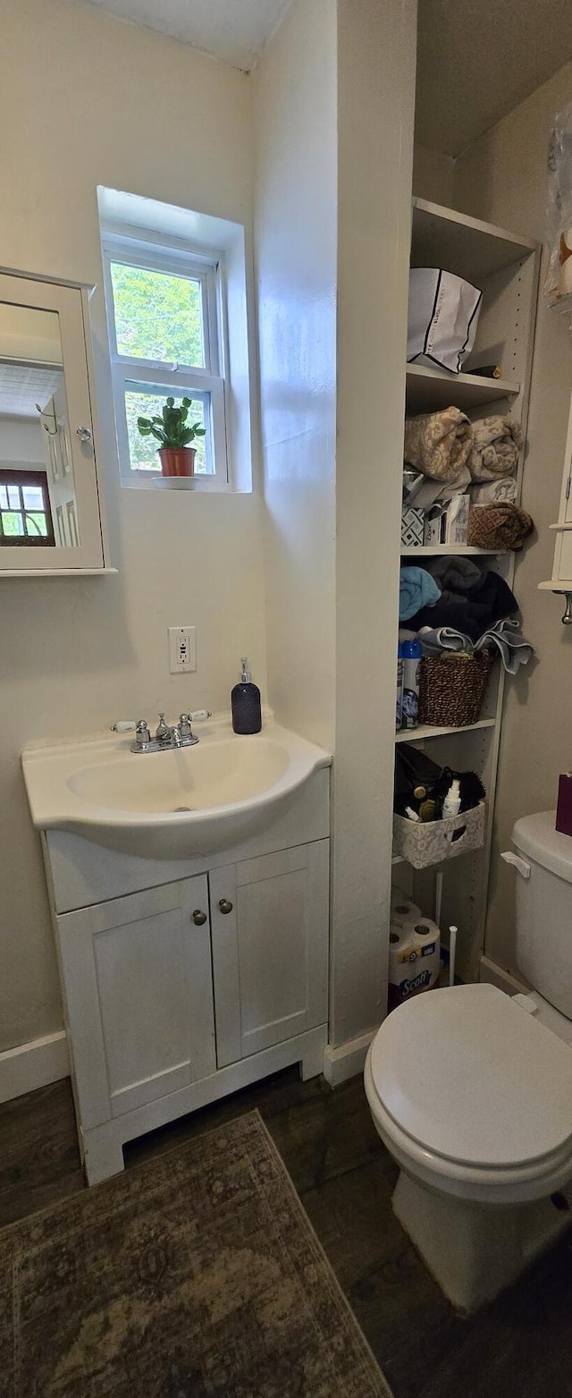 555 Depot St, Wilton, ME 04294 - bathroom with vanity and wood finished floors