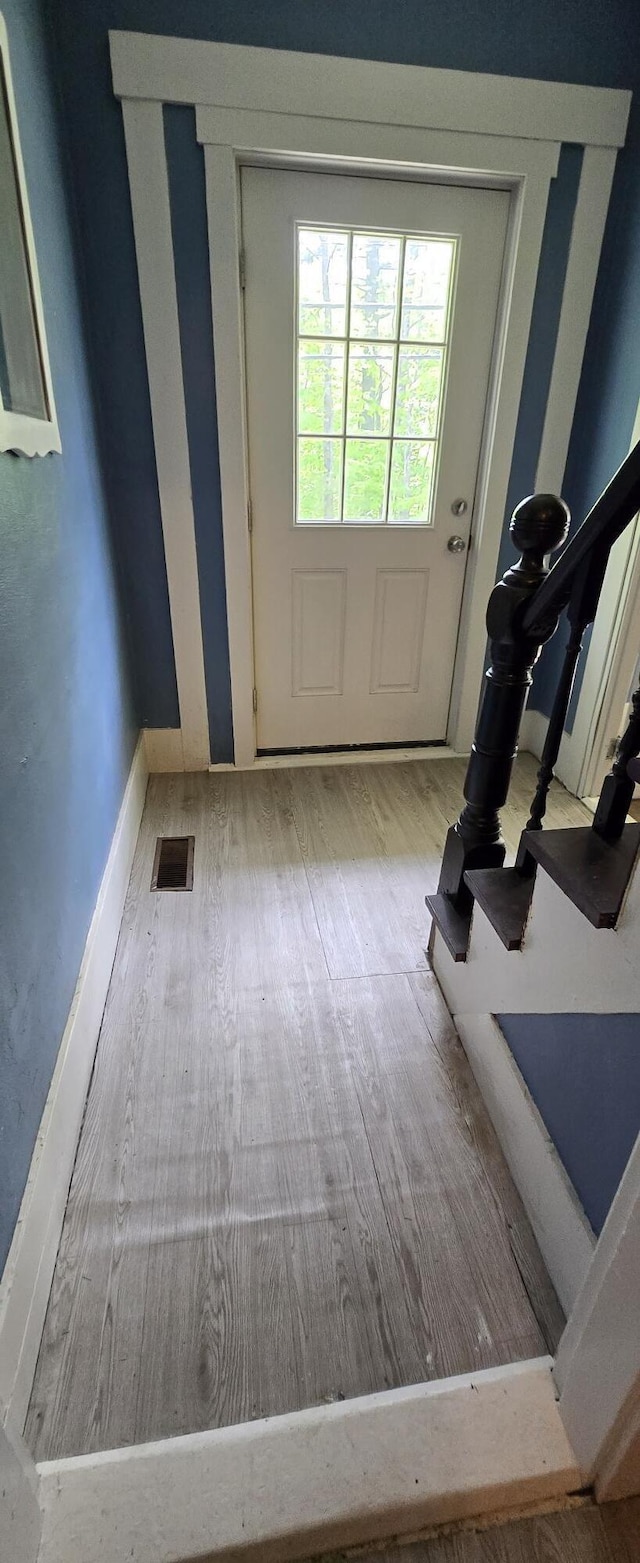 555 Depot St, Wilton, ME 04294 - doorway featuring wood finished floors and baseboards