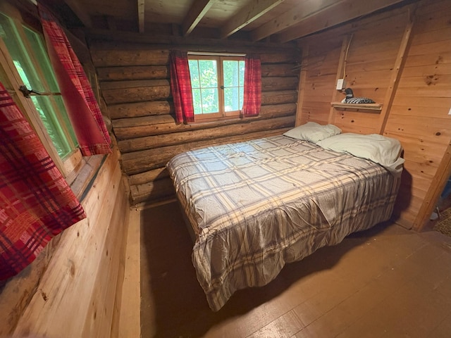 124 S Shore Dr, Rangeley Plt, ME 04970 - bedroom with log walls and hardwood / wood-style floors