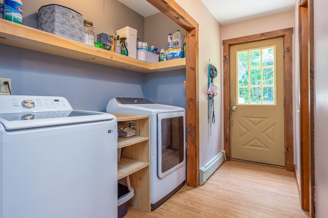 64 Pond View Dr, Otisfield, ME 04270 - washroom with baseboard heating, washing machine and clothes dryer, and light wood-type flooring