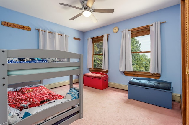 64 Pond View Dr, Otisfield, ME 04270 - bedroom featuring carpet flooring, a baseboard radiator, and a ceiling fan