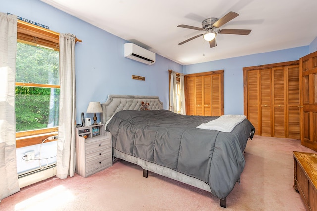64 Pond View Dr, Otisfield, ME 04270 - bedroom featuring a wall unit AC, light colored carpet, a baseboard heating unit, and two closets