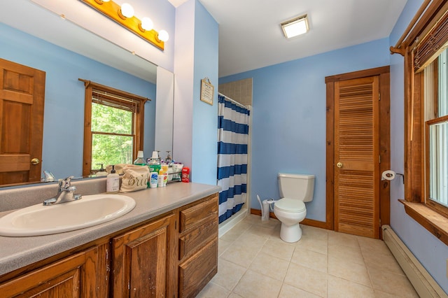 64 Pond View Dr, Otisfield, ME 04270 - bathroom with a baseboard heating unit, vanity, a closet, tile patterned flooring, and a shower with shower curtain