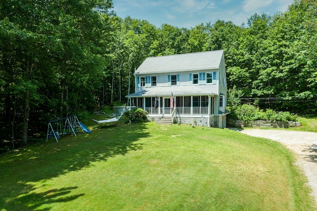 64 Pond View Dr, Otisfield, ME 04270 - view of front of property featuring covered porch, a front yard, a view of trees, and driveway