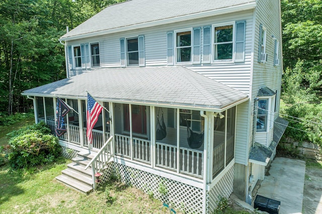 64 Pond View Dr, Otisfield, ME 04270 - view of front of property featuring a sunroom and a shingled roof