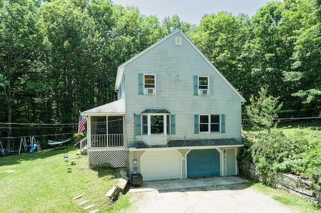 64 Pond View Dr, Otisfield, ME 04270 - view of side of home with a garage, concrete driveway, a sunroom, and a yard