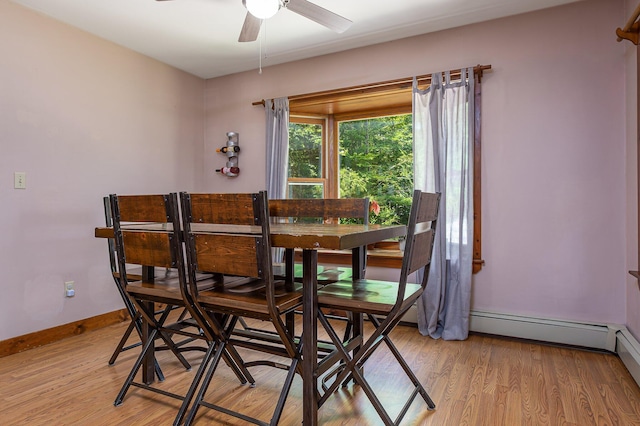 64 Pond View Dr, Otisfield, ME 04270 - dining area with ceiling fan, light wood finished floors, and a baseboard heating unit