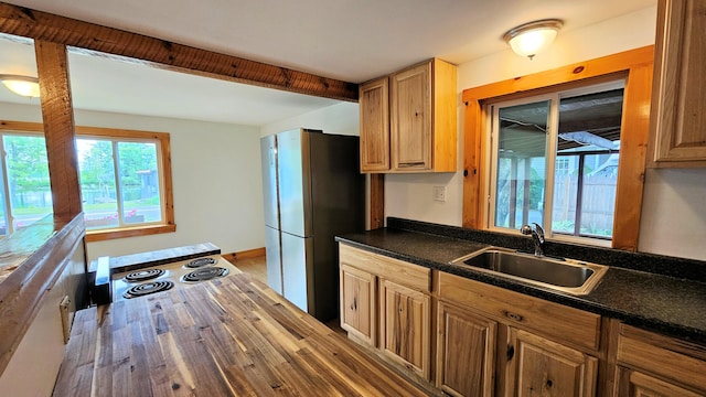 1106 S Belfast Ave, Augusta, ME 04330 - kitchen with freestanding refrigerator, dark countertops, range with electric cooktop, and wood finished floors