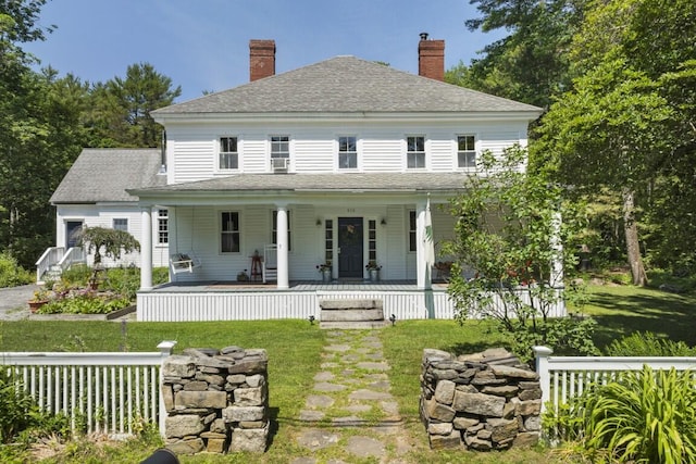 416 River Rd, Edgecomb, ME 04556 - back of property featuring a yard, a shingled roof, and a chimney