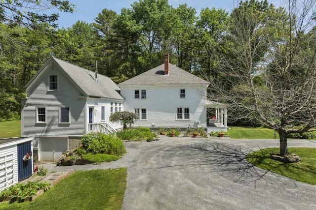 416 River Rd, Edgecomb, ME 04556 - view of front of house featuring a chimney, asphalt driveway, roof with shingles, and a front lawn