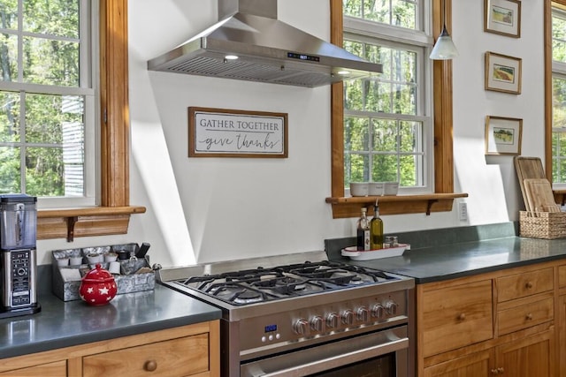 416 River Rd, Edgecomb, ME 04556 - kitchen featuring gas range, exhaust hood, plenty of natural light, and dark countertops