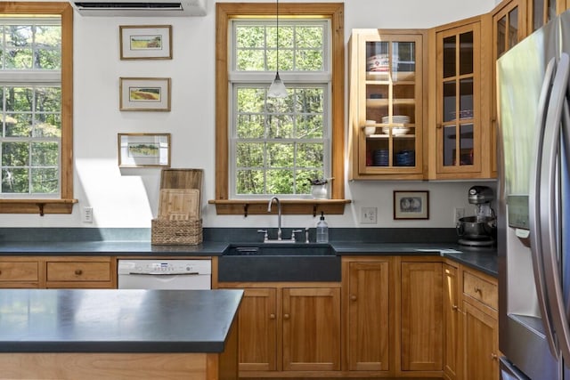 416 River Rd, Edgecomb, ME 04556 - kitchen with stainless steel refrigerator with ice dispenser, white dishwasher, dark countertops, and healthy amount of natural light