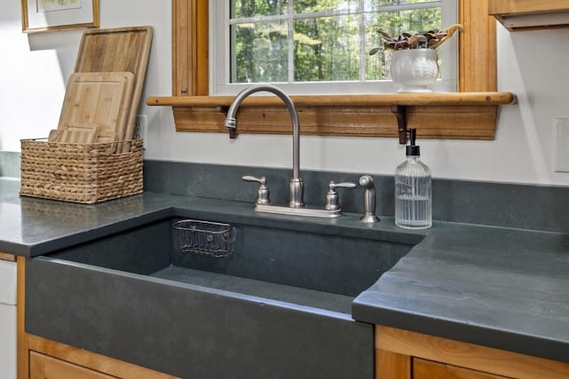 416 River Rd, Edgecomb, ME 04556 - kitchen featuring dark countertops and brown cabinetry