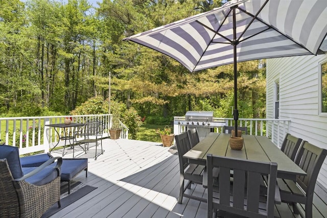 416 River Rd, Edgecomb, ME 04556 - wooden terrace with outdoor dining area and area for grilling