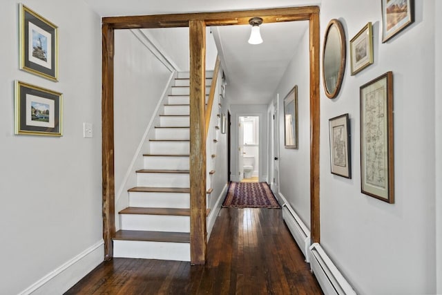416 River Rd, Edgecomb, ME 04556 - corridor with baseboard heating, hardwood / wood-style floors, and stairway