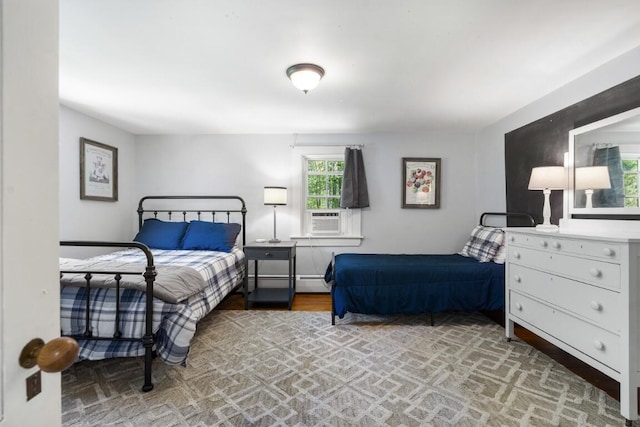416 River Rd, Edgecomb, ME 04556 - bedroom with cooling unit, wood finished floors, and a baseboard heating unit