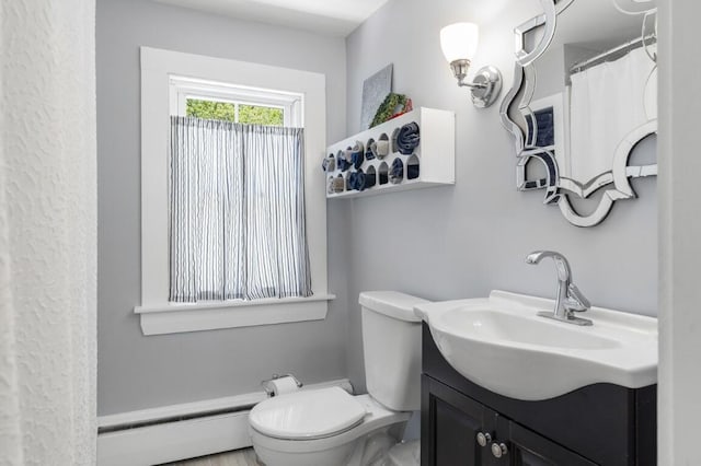 416 River Rd, Edgecomb, ME 04556 - bathroom featuring baseboard heating and vanity