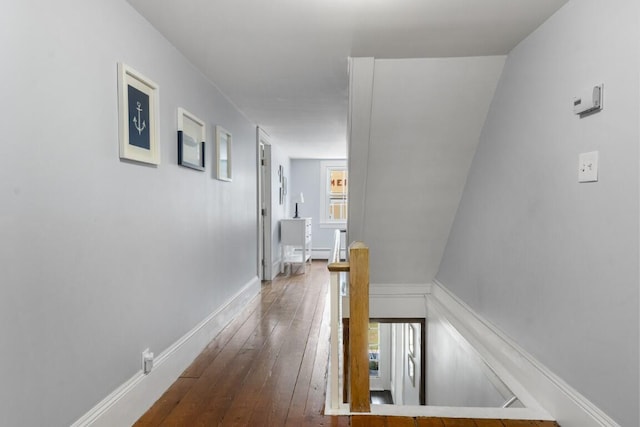 416 River Rd, Edgecomb, ME 04556 - corridor featuring an upstairs landing, dark wood finished floors, and a baseboard radiator