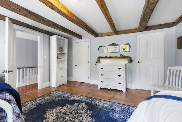 416 River Rd, Edgecomb, ME 04556 - bedroom with wood finished floors and beamed ceiling