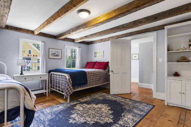 416 River Rd, Edgecomb, ME 04556 - bedroom with light wood-style floors and beamed ceiling