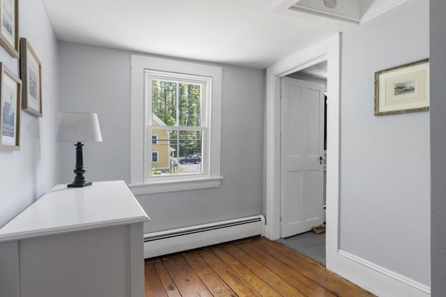 416 River Rd, Edgecomb, ME 04556 - hall with a baseboard heating unit and hardwood / wood-style floors