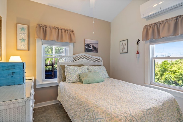 3 Island View Ave, Saco, ME 04072 - bedroom with a wall mounted air conditioner, lofted ceiling, and dark tile patterned flooring