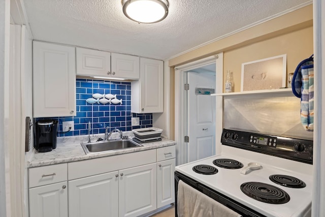 3 Island View Ave, Saco, ME 04072 - kitchen with electric stove, white cabinetry, a textured ceiling, light countertops, and decorative backsplash