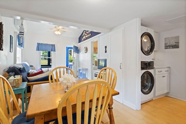 3 Island View Ave, Saco, ME 04072 - dining area with stacked washer and clothes dryer, light wood-style flooring, and a ceiling fan
