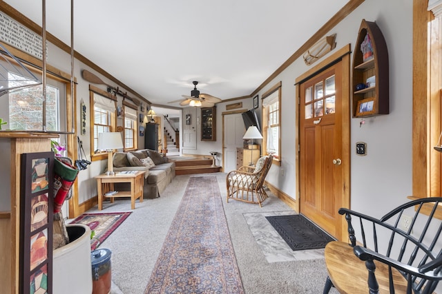 259 Mountain St, Camden, ME 04843 - carpeted living area with ornamental molding, plenty of natural light, stairway, and a ceiling fan