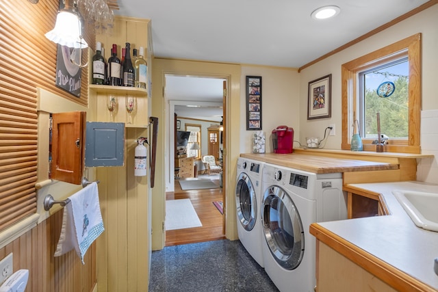259 Mountain St, Camden, ME 04843 - laundry area with electric panel, washer and clothes dryer, and crown molding