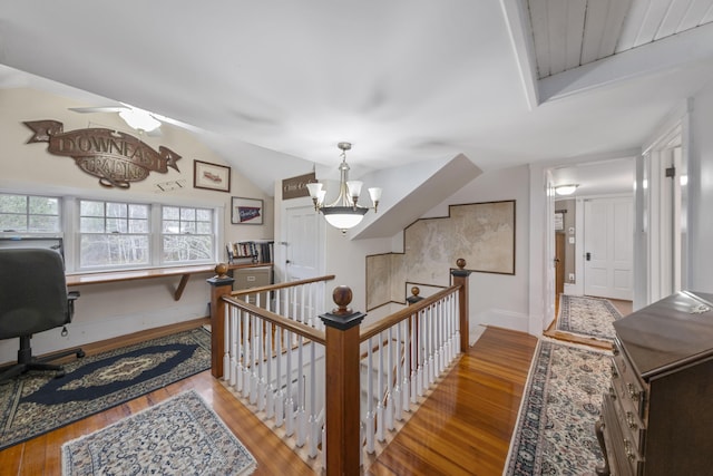 259 Mountain St, Camden, ME 04843 - hall featuring an upstairs landing, hardwood / wood-style floors, a chandelier, vaulted ceiling, and an office area