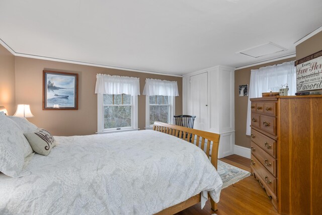 259 Mountain St, Camden, ME 04843 - bedroom featuring wood finished floors and attic access