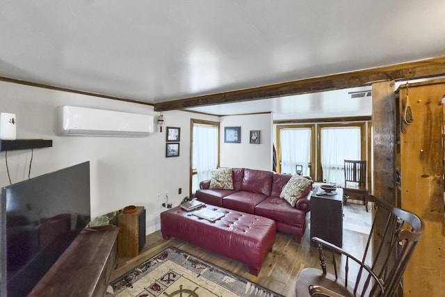 259 Mountain St, Camden, ME 04843 - living room featuring a wall mounted AC and wood finished floors