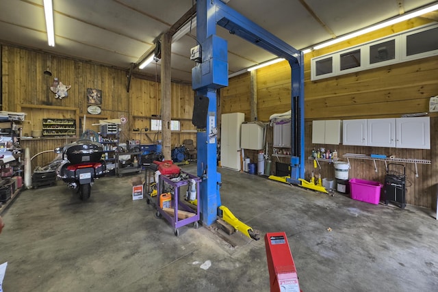 259 Mountain St, Camden, ME 04843 - garage featuring wood walls and a workshop area
